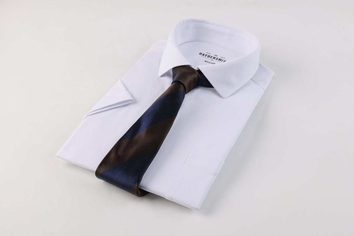 Folded white HAYDENSMITH CO missionary shirt with a navy and brown striped tie